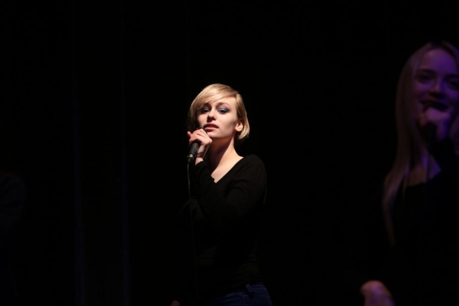 Senior Emily Wright sings her solo. On Feb. 21, The Ambassadors sang for the AGS middle school.