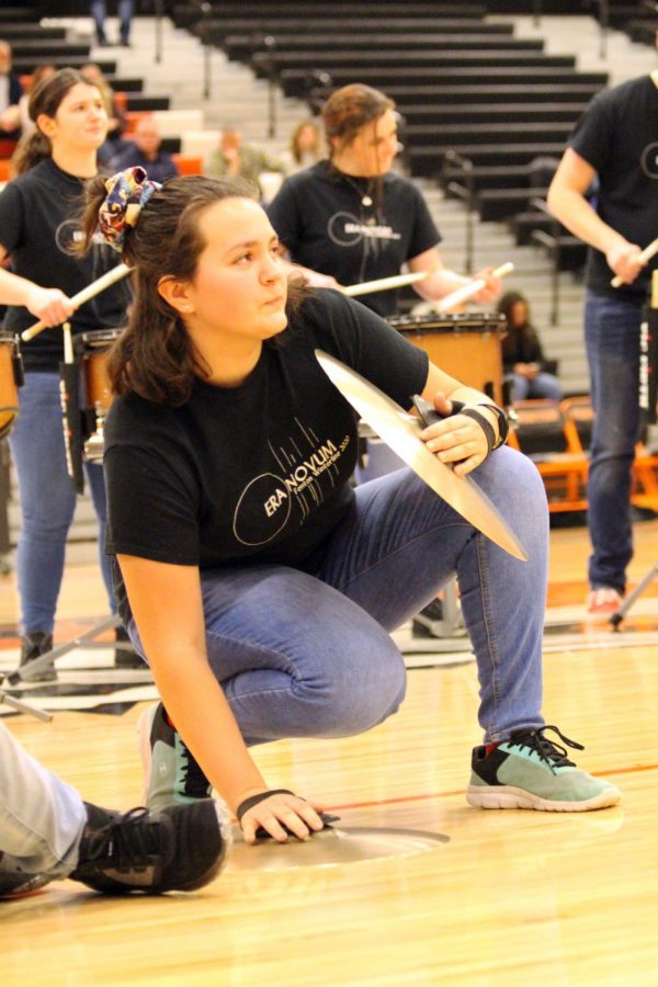 During halftime for the varsity boys basketball game, sophomore Samantha Megdanoff plays the cymbals in the drumline. On Feb. 28, the drumline and dance team put on a show during halftime.