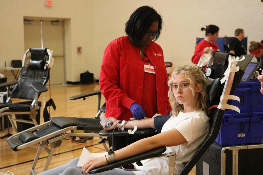 Senior Jaidyn Rodgers gets set up to get her blood drawn. On Mar. 9, a blood drive was held in Fentons auxiliary gym.  