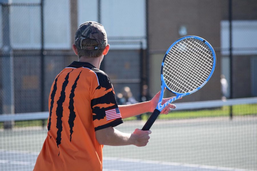 Sophomore Remington Book gets ready to attempt a forehand pass in order to hit the ball back to the opposing Goodrich player at the FHS tennis courts. The Tigers lost this match 3-5 on Sept. 17. 
