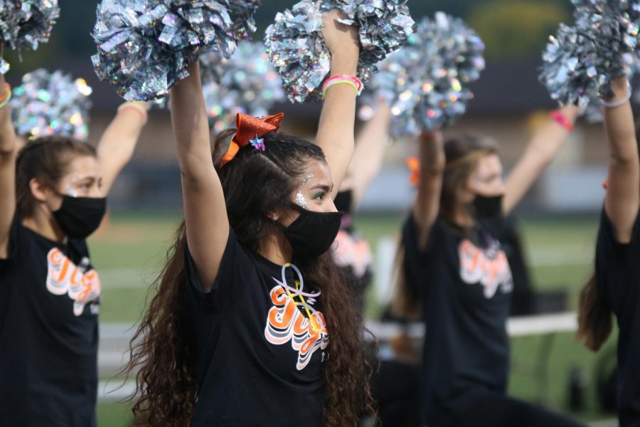Junior Elizabeth Diez finishes her cheer routine at Sept. 25s football game against Kearsley. FHS won the game 50 - 14.