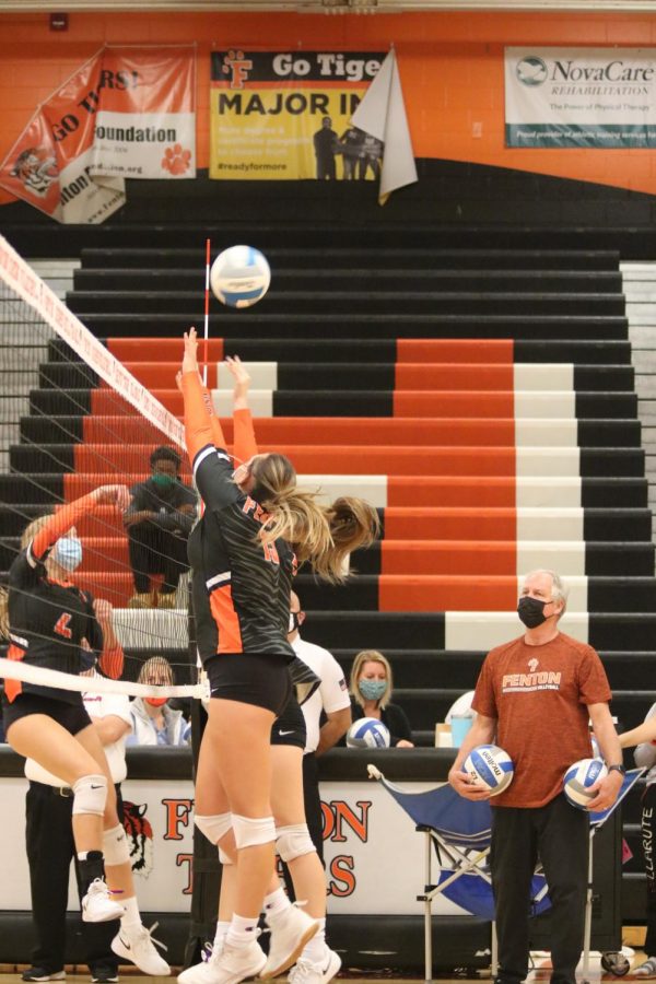 Freshman Adrie Staib goes up for a block during warmups. The varsity team later won all three of their matches against Kearsley.