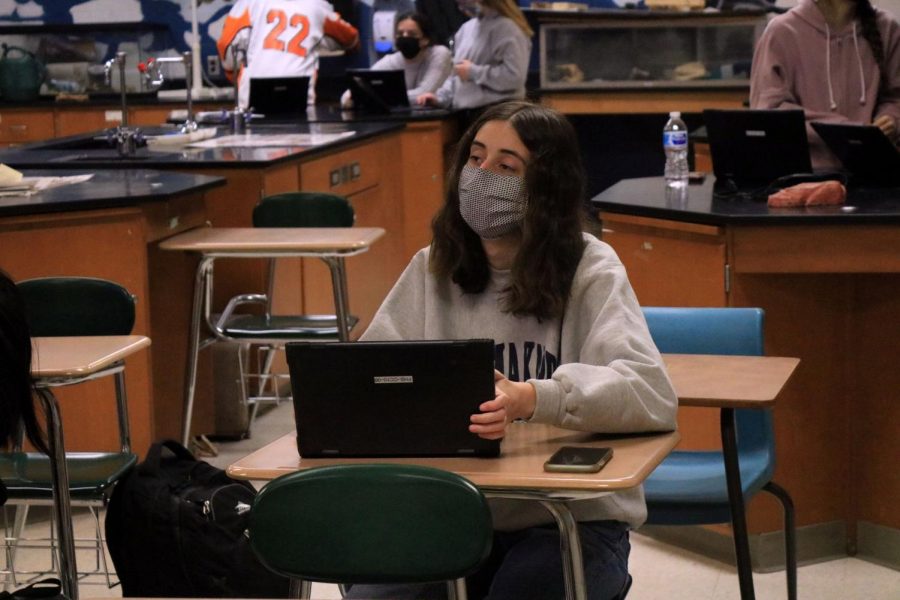 Junior Ceci Dockins looks at the viewboard in the front of the room while playing Kahoot on Feb. 25th. This was during anatomy class. 