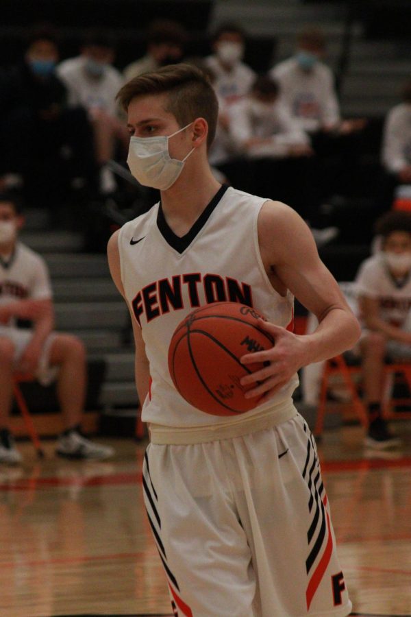 Freshmen Nolan Alvord is dribbling the ball down the court while playing against Kettering High (Waterford ) high school. The Tigers played Kettering on February 13th. 