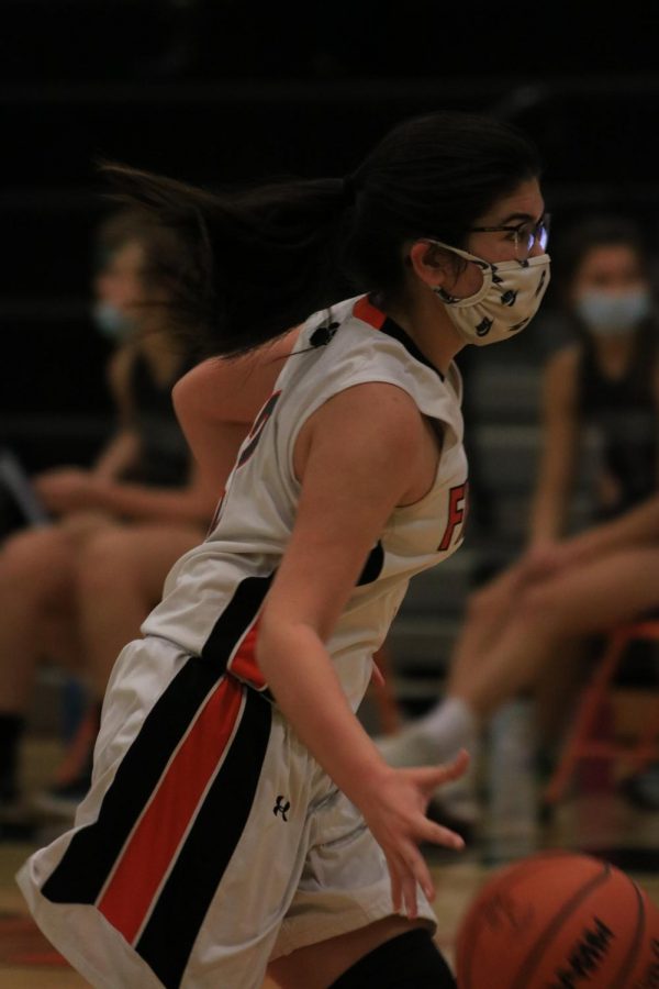 Freshman Naomi Durant gets ready to make a pass to her teammates on February 27th, 2021 in the Fenton High School main gym. 