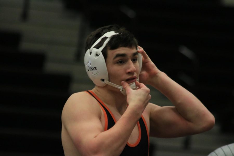 Freshman Ben Triola gets ready to face his next opponent in the Fenton High School main gym on March 6th, 2021. 