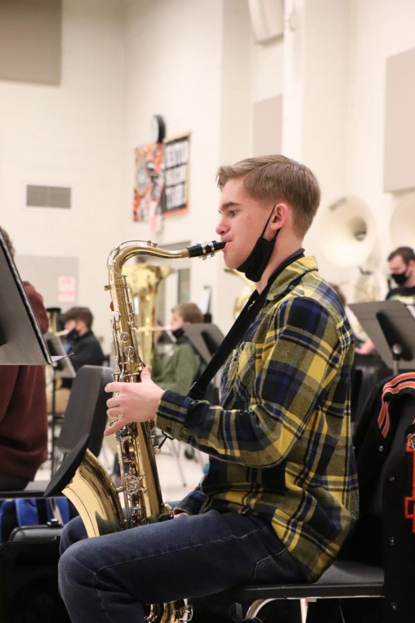 Junior Josh Maier plays his baritone saxophone while the band practices “The Mandalorian Theme” in Mr. Conatons band class. Josh is also the junior drum major for the Fenton Marching Tigers. 