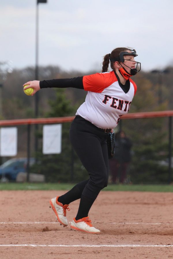 Freshman Ella Brown prepares to pitch the ball to their opponents Walled Lake Northern High School at the Fenton High School softball field  on April 14, 2021. 