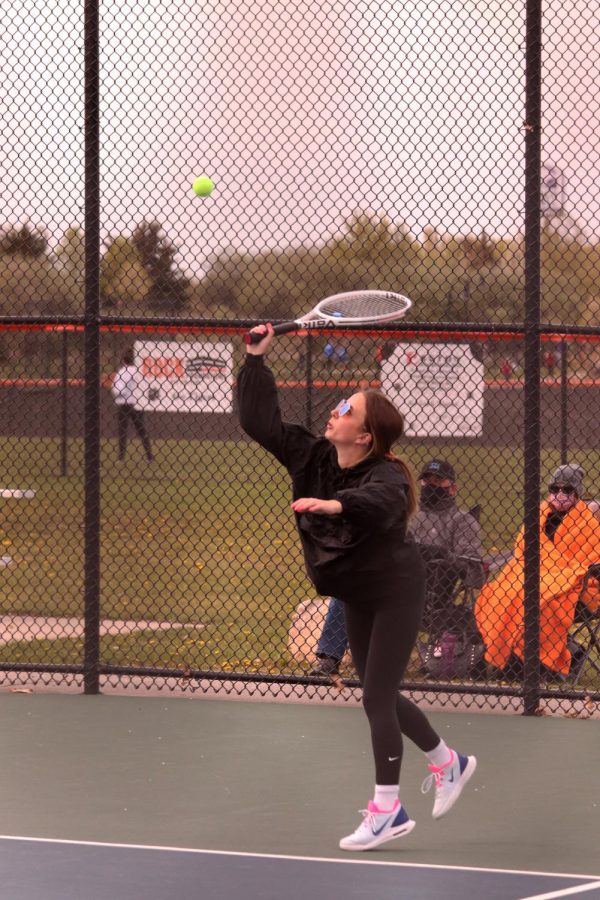 Junior Kiersten Lapa returns a serve from Holly in attempt to score her team a point. The girls tennis team emerged victorious after many difficult matches against the Holly Bronchos on April 26. 