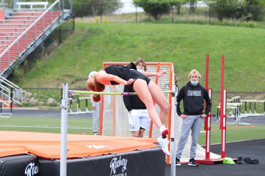 Freshman Ava Pyeatt jumps over the bar to clear the height in the meet on May 4th. 