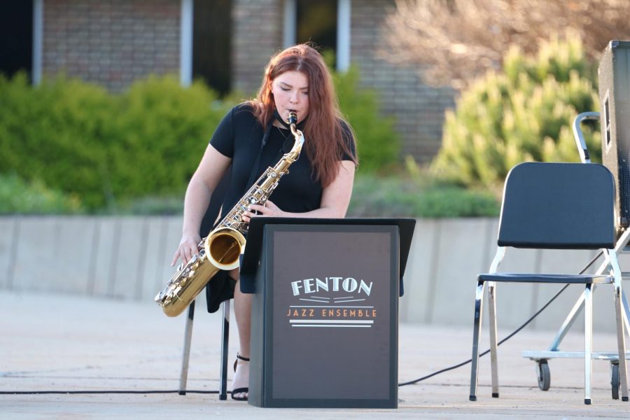 Junior Audrey MacLean plays her tenor saxophone during the jazz bands performance of Honeysuckle Rose. The bands had a combined spring concert on May 13.
