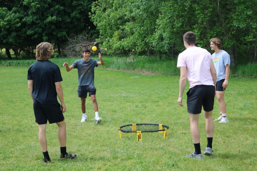 During Mr. Sullivans class, junior Ethan Bright serves the ball.  On May 25 Sullivans class played spikeball outside and made a slip-and-slide. 