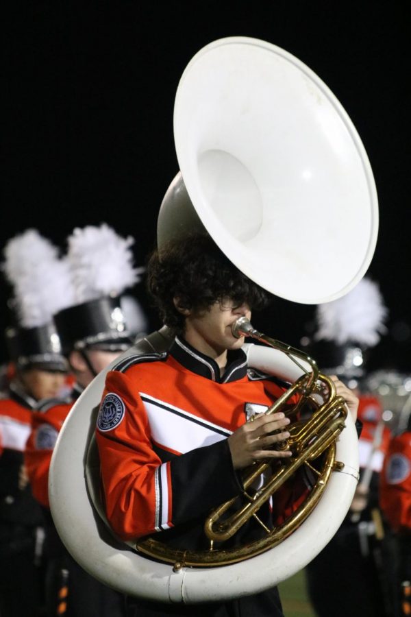 Sophomore Elijah Thomas plays the tuba during the Fenton vs. Swartz Creek halftime show. The Tigers played against Swartz Creek on Sept. 17 and won 41-27.  