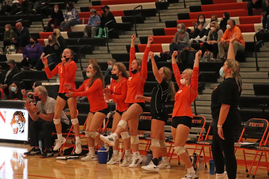 Sophomores Angelina Depifano, Kariana Pelky, Olivia Shampo, Marissa Frazier, Allie Mowery and Shea Temrowski cheer as the Tigers score a point against the Hornets, winning the set 25-16. The Fenton Tigers Varsity volleyball team beat the Kearsley Hornets in all three sets on Sept. 22.