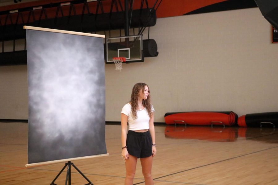 Junior Jamie Kemp smiles while getting her picture taken. Picture day was on Sept. 14 for students in 9th-11th grade. 