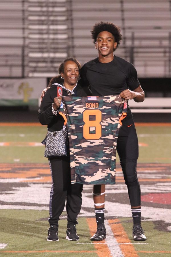 Sophomore JaHion Bond honors a family related veteran on the Fenton High School football filed with his jersey. On Sept. 10, FHS held a Heroes Night where they honored veterans with their jerseys. 