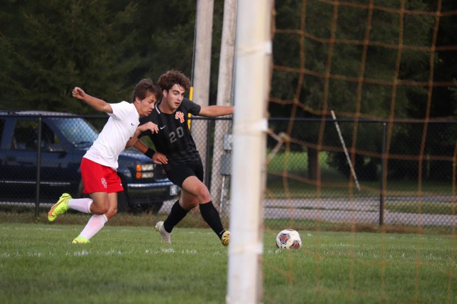 Senior Calvin Curtis charges to the goal while avoiding an opponent. On Sept. 1, Fenton defeated Swartz Creek 6-0.