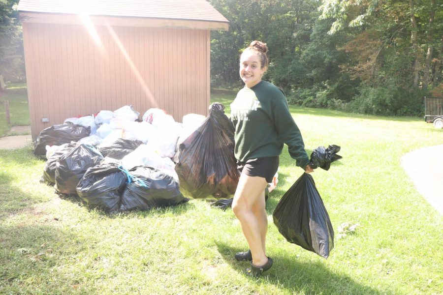 Senior Halee Alexander collecting bottles . On Sept.17 the fenton swim and dive team organized a day that they could go out and do a bottle drive to get money for the team. 