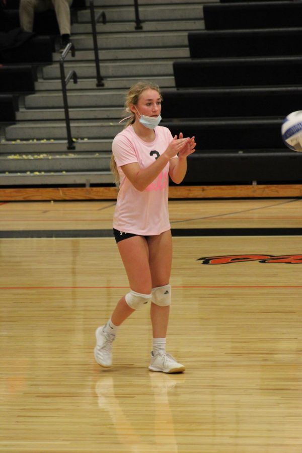 Senior Bella Henson claps after scoring a point against  Flushing varsity volleyball on Oct. 7.  Fenton went to a full five sets against Flushing and sadly ended up losing. 