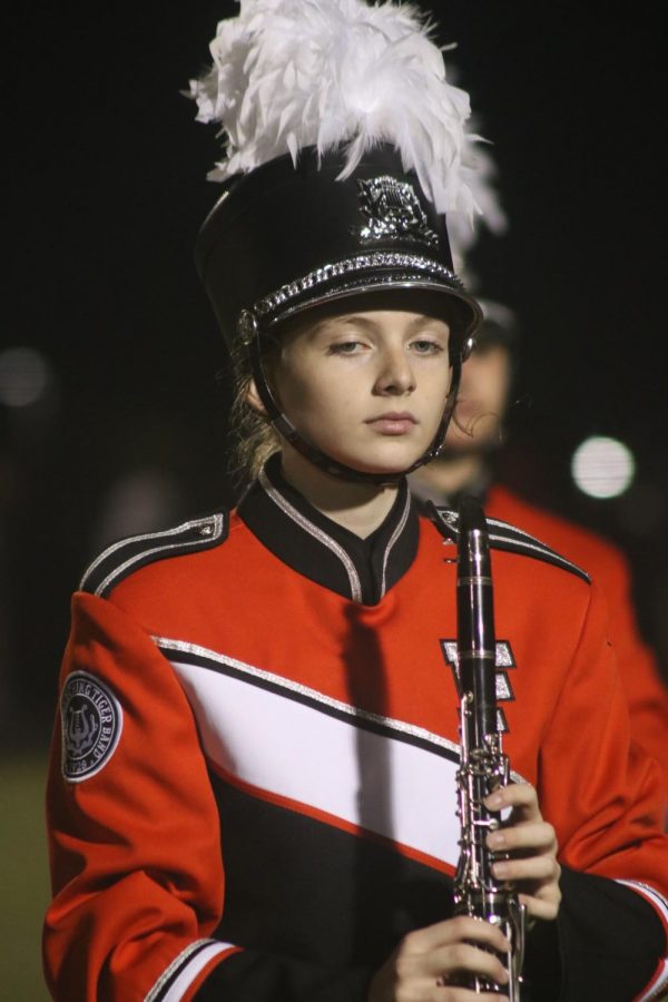 Sophomore Emerson Sayer prepares to perform Awesome Mix 1 at the Linden vs Fenton halftime show on the FHS football field. Fenton played Linden on Oct. 8, due to a rain delay the game had to postponed and resumed on Oct. 9, and Fenton beat Linden 36-34.  