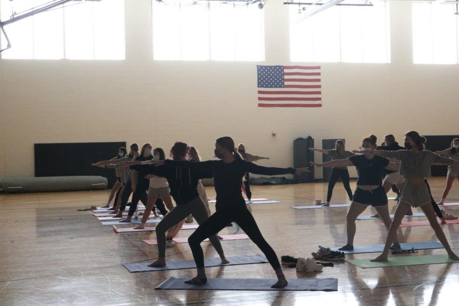 Sophomore Ava Pyeatt learned how to do yoga in the auxiliary gym. On Oct. 13, the girls fitness and conditioning learned how to take control of their mind and body with Sunny and Sunnys handler, District Media Specialist Rachael Hassell. 