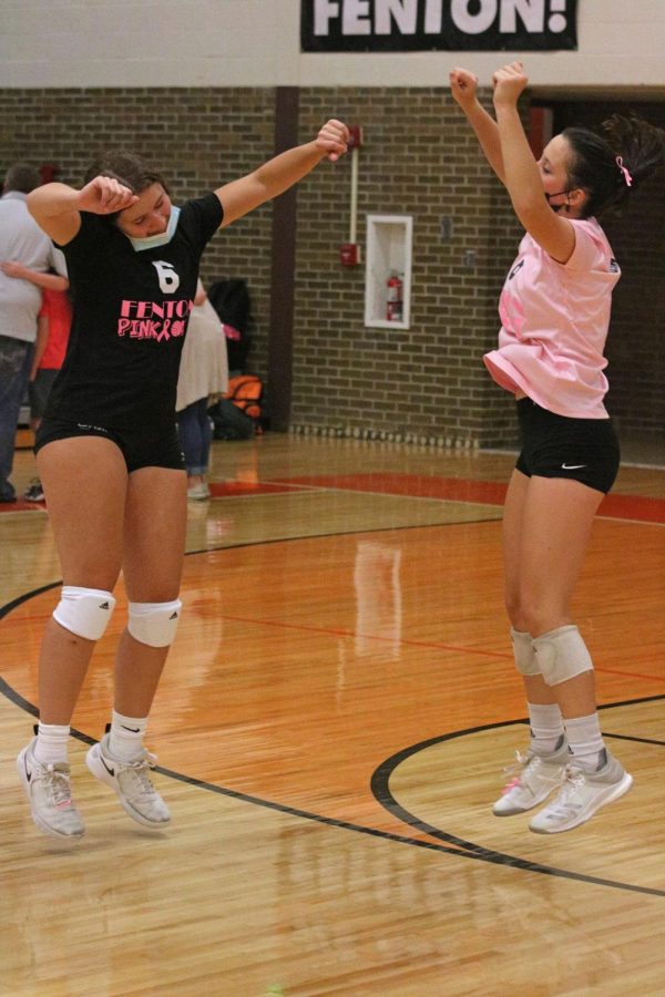 Jumping for joy, sophomores Jena Fijolek and Emily Cryderman dance in between matches. On Oct 6. the Tigers JV volleyball team beat the Flushing Raiders in 2 out of 3 matches.   