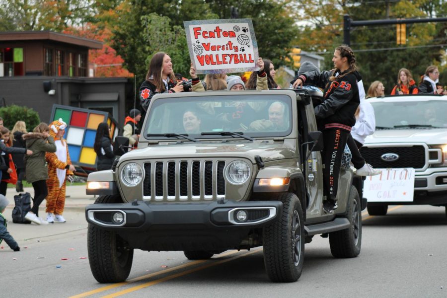 The varsity volleyball team rides in the homecoming parade to show team spirit. On Oct. 22, they rode in the downtown parade for homecoming week.