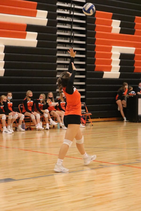 Freshman Ava Slezinski is setting up a serve. On Oct. 20, freshman volleyball won against Holly.