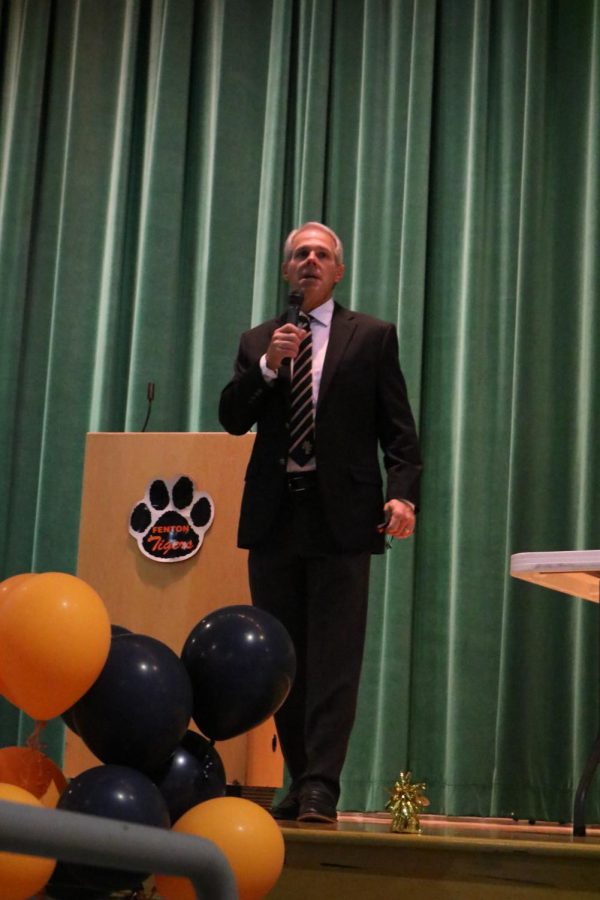 FHS varsity football coach Jeff Setzke introduces the varsity team at the banquet at AGS Middle School. On Nov. 3, the freshman, JV and varsity teams were honored for the football season. 