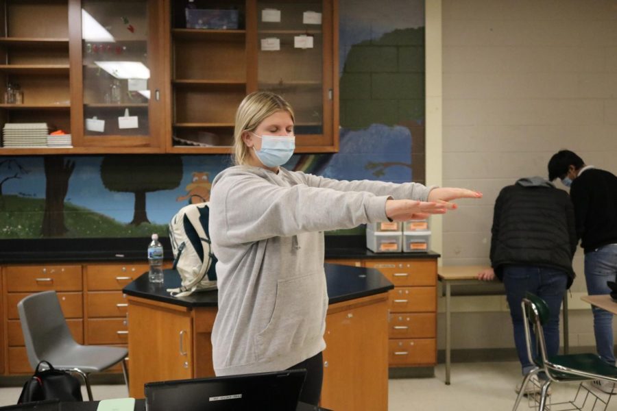 Junior Megan Mcdermott holds her hands out in front of her for a balance test. Mcdermott did this for an anatomy lab on Tuesday, Nov. 17.