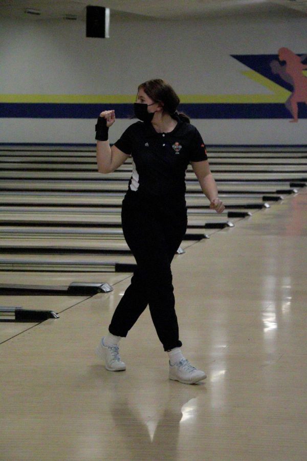 Sophomore Jena Fijolek celebrates after bowling. On Dec. 16, the girls bowling team competed against Swartz Creek.