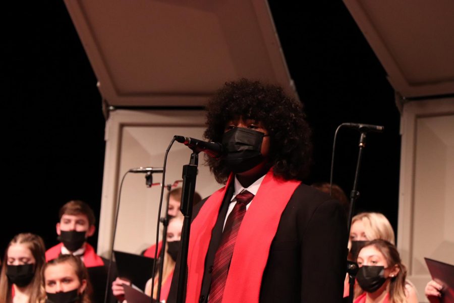 Junior Ibrahim Sene performs a solo during the last song of the show. The FHS choirs all collaborated for a holiday performance on Dec. 9. 