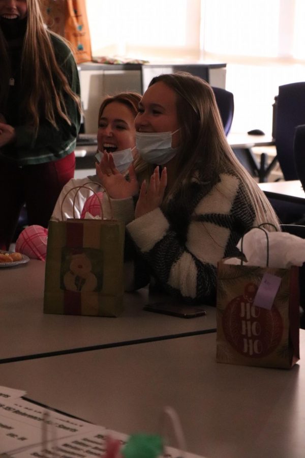 Senior Maddie OLeary-Baxter laughs as she finds out who had her name for Secret Santa. On Dec. 17, the Fentonian staff celebrated Christmas with a party and a Secret Santa gift exchange. 