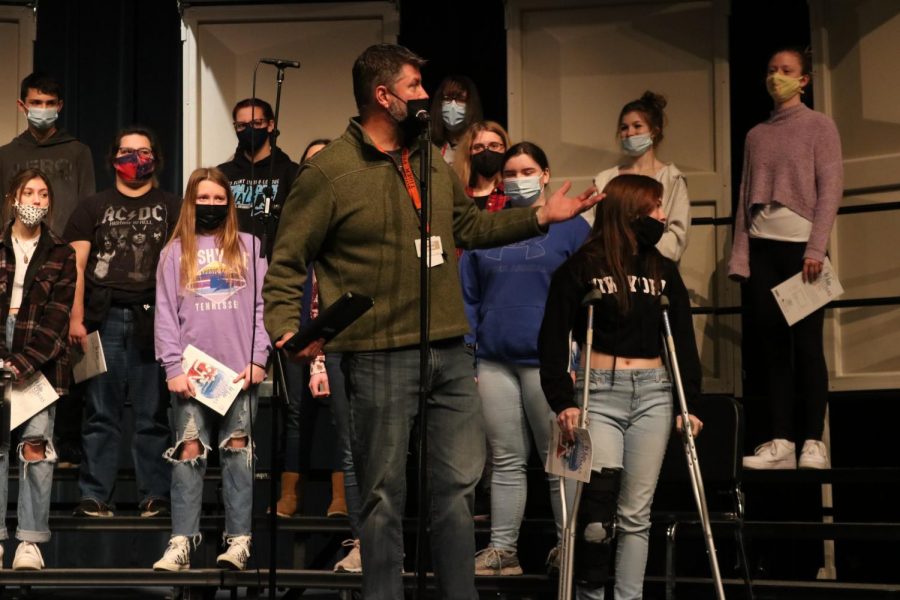 FHS choir Brad Wright directs choir students to enter the stage while rehearsing. A choir rehearsal was held on Dec. 9 to prepare for the Christmas concert that was held that evening. 