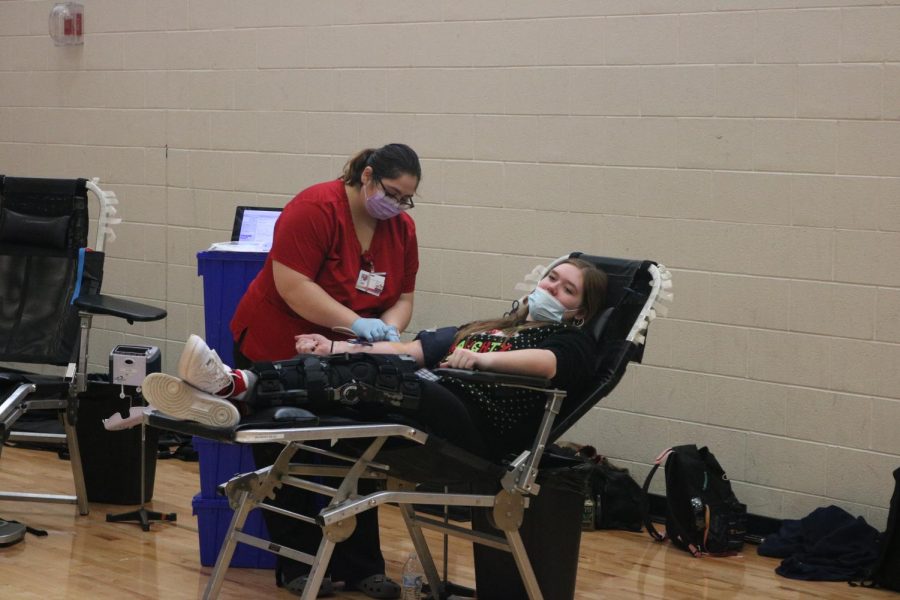Junior Erin McVey gets her blood drawn for the Red Cross. The National Honor Society hosted their annual blood drive on Dec. 16. 
