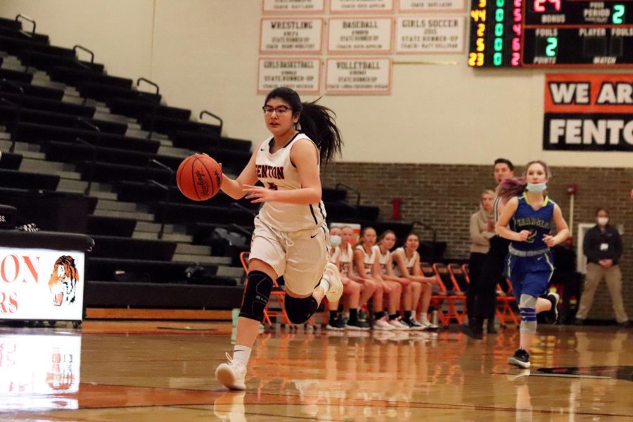 Dribbling+down+the+court%2C+sophomore+Naomi+Durant+drives+to+attempt+to+score+a+layup.+On+Jan.+7%2C+the+JV+girls+basketball+team+took+on+the+Kearsley+Hornets+and+won+53-8.