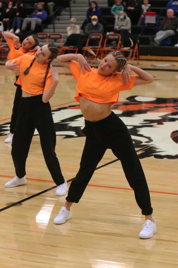 Dancing with her team, sophomore Alaina Linders performs during halftime. On Jan. 7, the FHS Adrenaline dance team had their first basketball game performance.