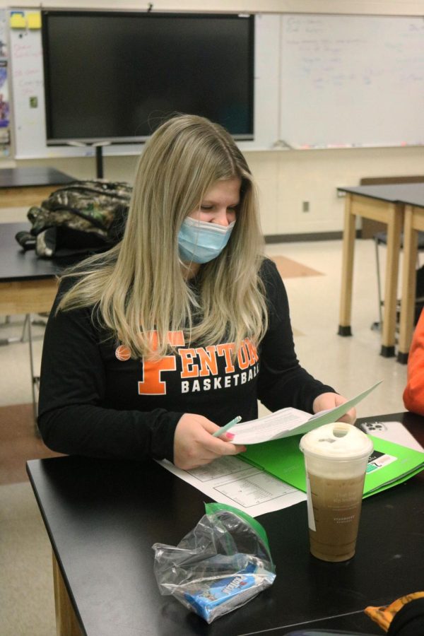 Junior Megan McDermott reviews her notes during an Empirical Formula Lab. On Jan. 21, FHS teacher Chuck Millers Chemistry class completed the lab. 