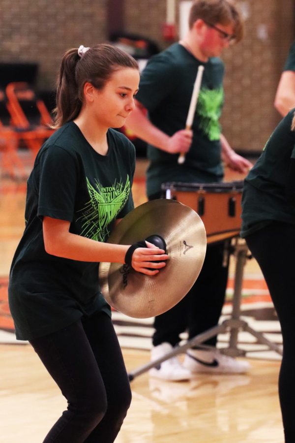 Junior Elle Jones plays the cymbals during the varsity girls basketball game. On Feb 8. the FHS drumline performed at halftime of both girls and boys basketball games. 