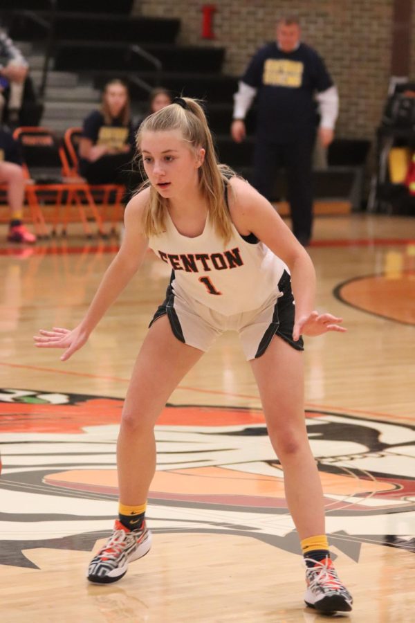 Junior Grace Macaughan attempts to prevent the opposing team from making a basket. The Fenton HS varsity girls basketball team played against Holly on Feb. 4 and won 39-23. 