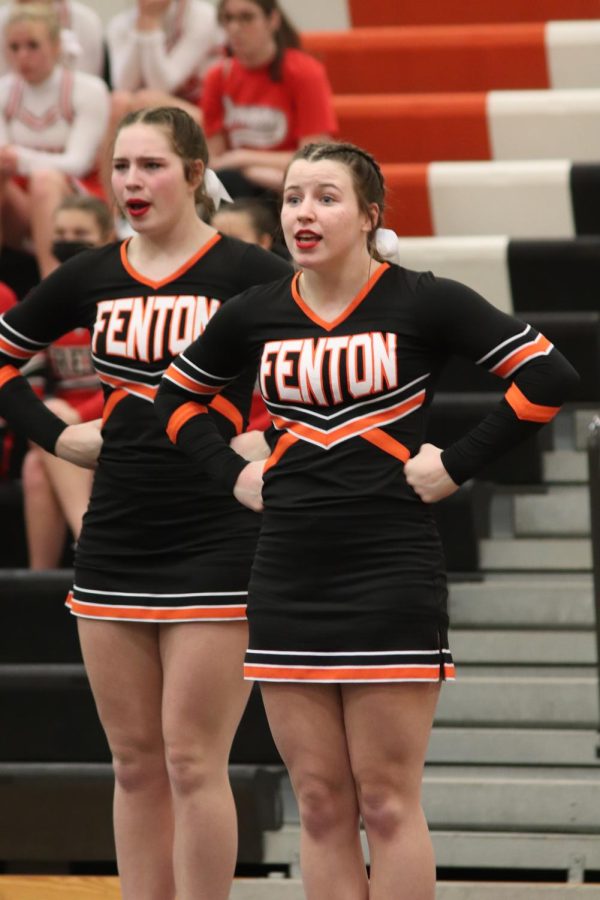 Junior Baleigh Koza performs alongside the Fenton varsity girls competitive cheer team during the Flint Metro League performance at Fenton High. The FHS varsity cheer team won the Flint Metro League Championships on Feb. 11. 