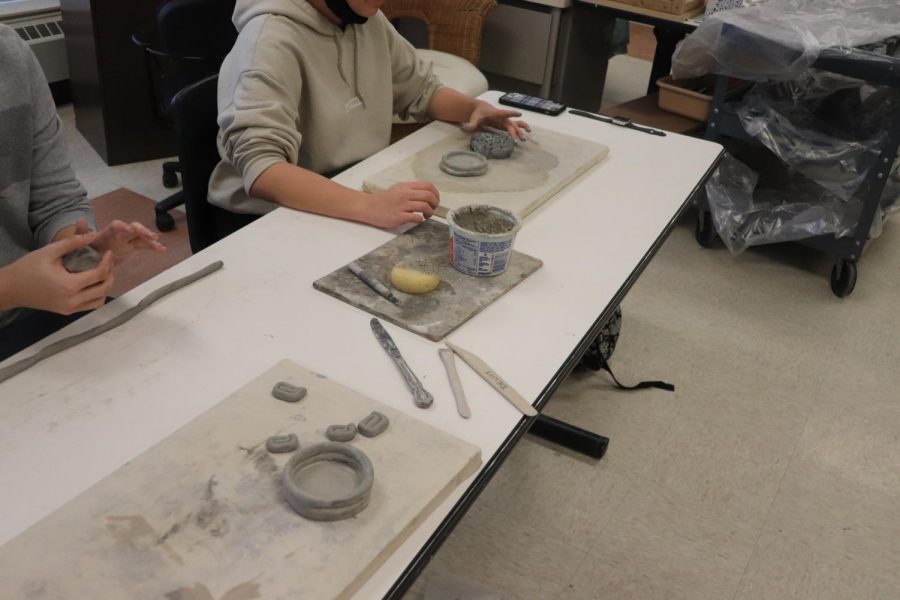 Mrs. Jambecks 4th hour art class is making clay pots. On wed. 2/22, sophomore Mary Kathrine is getting slip to make sure her clay pot does not fall over. 