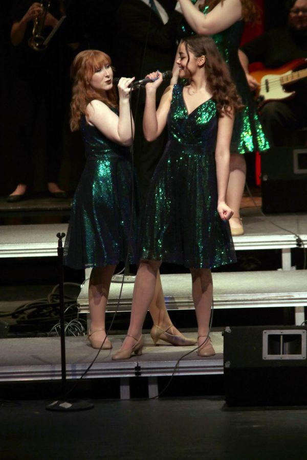 Juniors Ella Beck and Davenie Blackwell perform together. On Feb. 26, the FHS Ambassadors had their Its Been a Long, Long Time concert. 