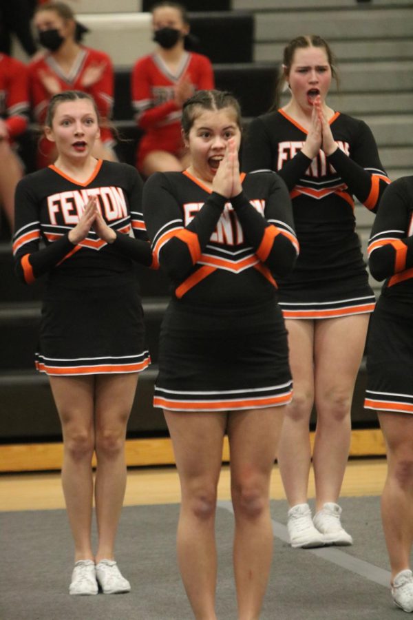 Senior Kailey Bombe, along with her teammates chant in round one of the competition. On Feb. 19, FHS hosted the Michigan High School Athletic Association where varsity cheer took home first place with a total score of 731.02. 