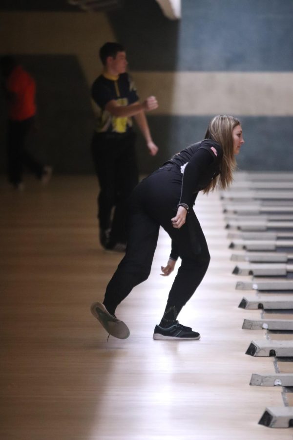 Junior Katelyn Burkett bowls down her lane attempting to bowl a strike. The varsity girls bowling team played against the Corunna Highschool team at Colonial Lanes on Jan. 29.