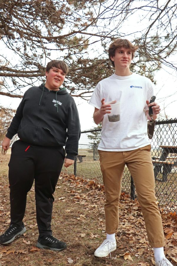 Freshmen Jaiden Tambs and Connor McDermott dig for worms by the FHS pond to feed the new class pet. On March 19, students searched for worms to feed their new class pet in physical science teacher, Nicholaus Jefferys, classroom; that day the students welcomed their new friend, an axolotl. 