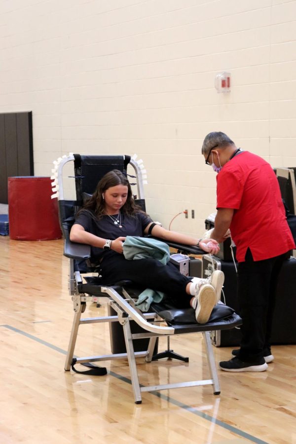 Junior Jamie Kemp gets her blood drawn for the Red Cross. On April 28, The National Honor Society organized and put on the last blood drive of the school year.  