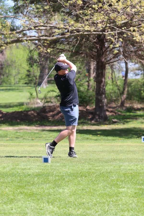 Swinging his club, junior John Sage drives the golf ball. On May 13, Fenton Highs JV boys golf team played in a tournament hosted by Kearsley. 