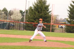 Pitching the ball, sophomore Nicholas Simeoni attempts to strike out an opponent. On May 5, the Fenton JV baseball team took on the Linden Eagles and won 18-3. 