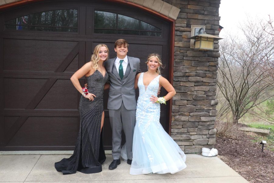 Seniors Jordyn Bommersbach, Seth Logan and Olivia Resa were posing for a picture. On April 30. the juniors and seniors had prom. The pictures were hosted at Justin Millerss house.